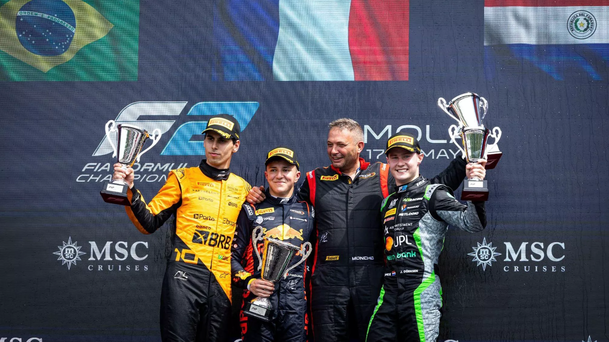 F2 Imola feature race winner Isack Hadjar (centre) with second-place finisher Gabriel Bortoleto (L) and third-place finisher Joshua Durksen (R)