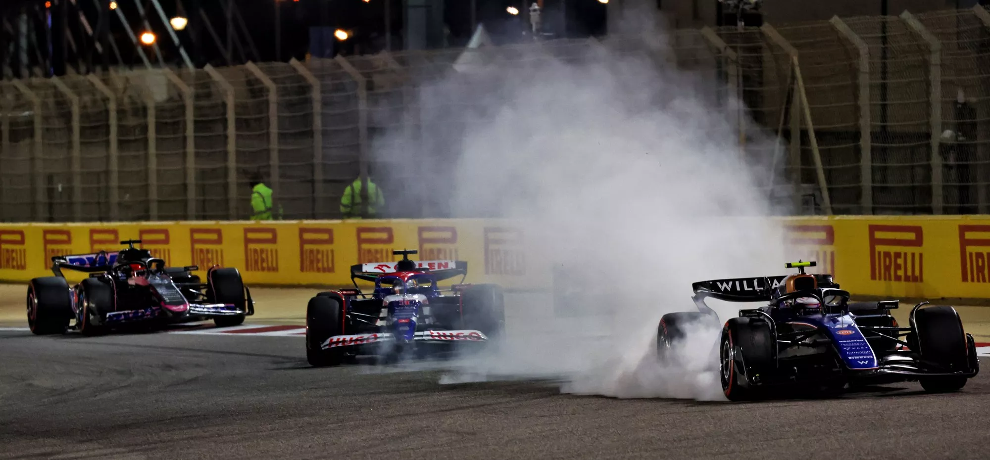 Williams F1 car locking up its front left tyre causing some tyre smoke.