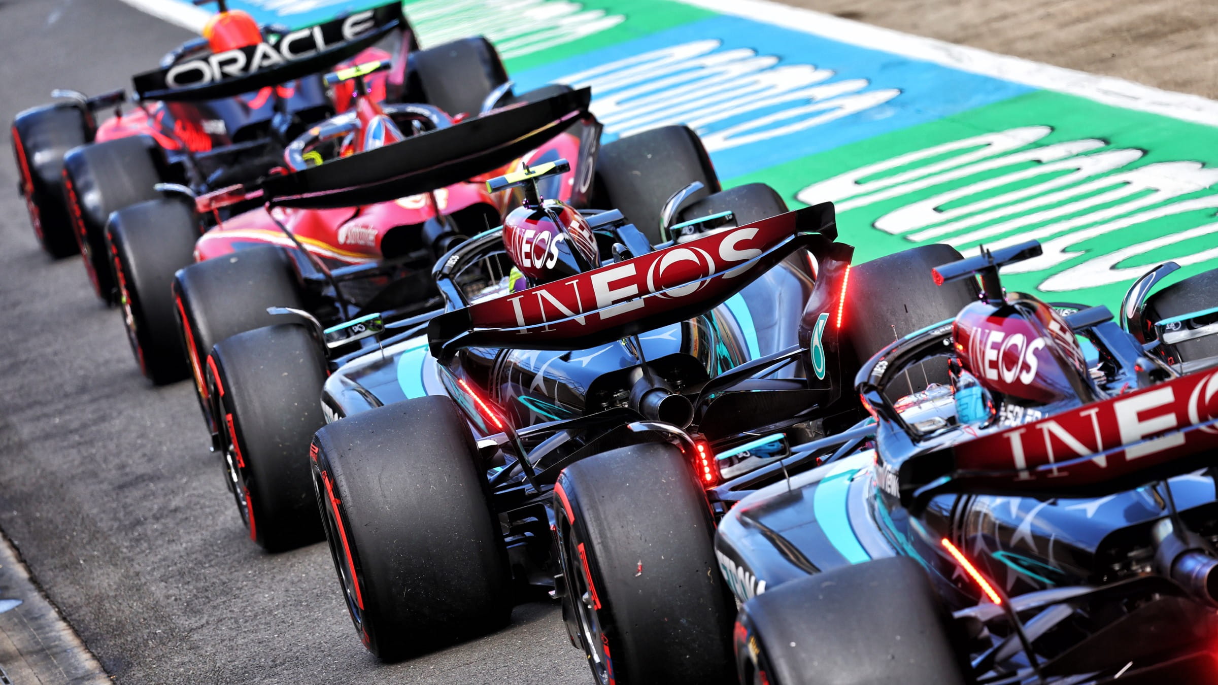 Line of F1 cars in the pitlane