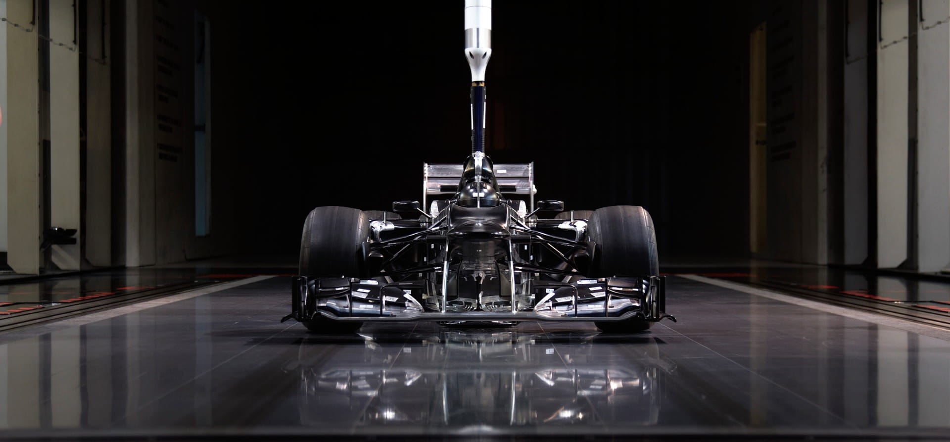 Scale model of a Mercedes F1 car inside a windtunnel