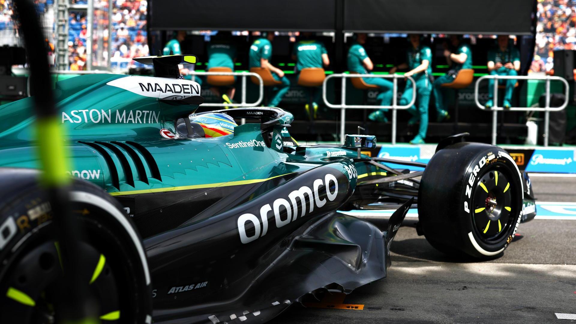 Aston Martin F1 car exiting garage